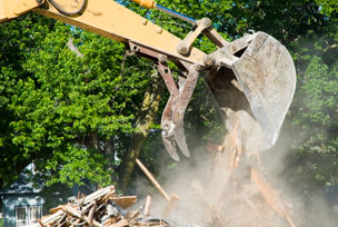 Backhoe Demolition And Removal Of Site Debris