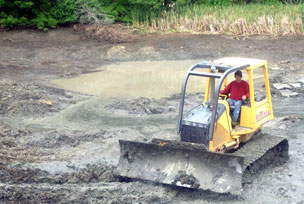 Pond Being Constructed With Heavy Equipment Contractors