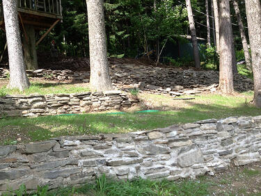 Stone retaining walls with septic tank access